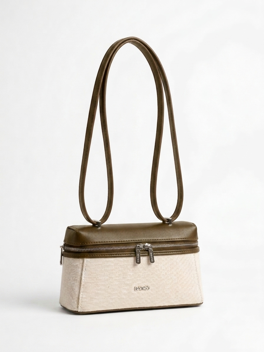 Sac à main structuré bicolore beige et kaki, avec longues anses fines, fermeture zippée sur le dessus et design élégant minimaliste.