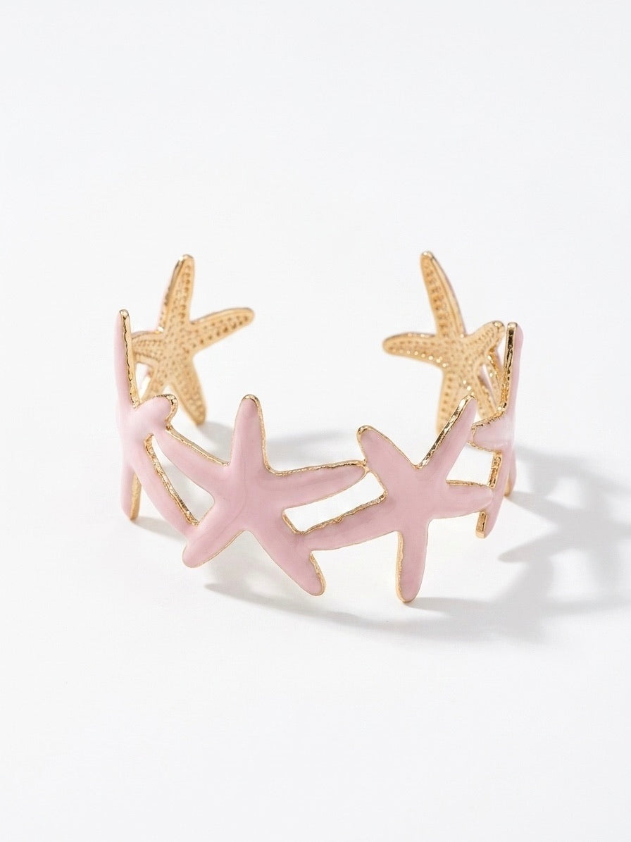 bracelet manchette à motifs étoiles de mer rose poudré et doré