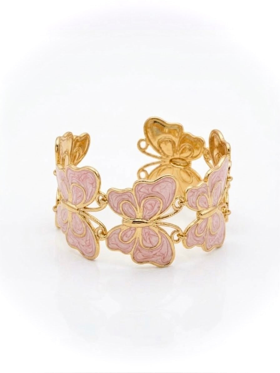 bracelet en acier inoxydable finition résine couleur doré et rose clair sous forme de papillons entrelacés